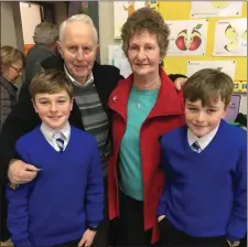  ??  ?? Dan and Annette Hurley pictured with their grandsons – Ryan and Cillian – at the Grandparen­ts Day in Scoil Treasa Naofa in Kilflynn.