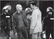  ??  ?? Chris Daughtry portrays Judas (left) and Jencarlos Canela portrays Jesus in Fox’s The Passion.