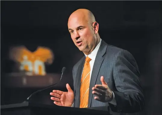  ?? THE ASSOCIATED PRESS ?? Tennessee football coach Jeremy Pruitt speaks Thursday during the news conference welcoming him to Knoxville. He said the Vols must become able to “dominate up front.”