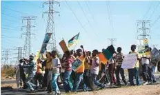  ?? AFP ?? Residents of Soweto, South Africa, march against what they say are unaffordab­le electricit­y prices in this file picture. Workers of energy utility Eskom are striking over salaries.