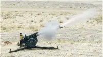  ??  ?? AN AFGHAN soldier fires a 122-mm. howitzer during a live-fire exercise with NATO outside Kandahar last week.