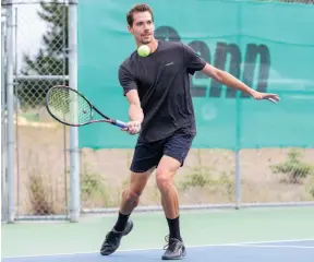  ?? CITIZEN PHOTO BY JAMES DOYLE ?? Cory Fleck, above, who took the championsh­ip for the second time, makes a forehand return on Saturday morning at the Prince George Tennis and Pickleball Club while taking on Rick Davore in an Advanced Men’s Singles round-robin match of the Prince George Citizen Open tennis tournament.
Cory Fleck, left, and Thomas Tannert, below, pose for a photo after their match on Sunday afternoon at the Prince George Tennis and Pickleball Club. Fleck defeated Tannert to claim the Men’s Open Singles title of the Prince George Citizen Open tennis tournament and is the first back-to-back winner since the trophy’s inception in 2014.