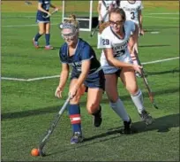  ?? GENE WALSH — DIGITAL FIRST MEDIA ?? North Penn’s Bri O’Donnell reaches for a loose ball as Plymouth Whitemarsh’s Meghan DiGiacomo defends during their District 1-3A second round game Wednesday.