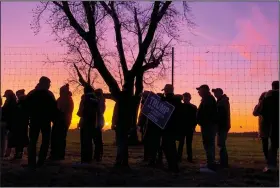  ?? (AP/Morry Gash) ?? Supporters wait in line Monday to see President Donald Trump speak at a campaign event at the Kenosha Regional Airport in Kenosha, Wis.