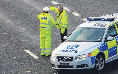  ?? Picture: Steve MacDougall. ?? Police at the scene of a road accident near the Friarton Bridge.