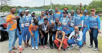  ?? Picture: SUPPLIED ?? WORKING HARD: Komani Runners Club members celebrate after a successful run in which many of them recorded personal best times.