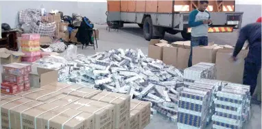  ??  ?? FINANCIAL CRIME: Police recently raided a warehouse in Brackenfel­l, after a tipoff, where they found a safari tour truck from Zimbabwe filled with cartons of illegal cigarettes. A toilet in the warehouse also contained numerous boxes of cigarettes. The...