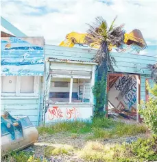  ?? Photo / Warren Buckland ?? Above: The bach mid-demolition at Haumoana.