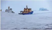  ?? AP file ?? An icebreaker makes way for a cargo ship near a port on the Alexandra Land island near Nagurskoye, Russia.
—