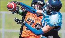  ?? CLIFFORD SKARSTEDT EXAMINER ?? Peterborou­gh Junior Varsity Wolverines defensive back Jordan Twa, left, breaks up a pass intended for Toronto Jr. Argos receiver Joshua Satov during OFC action June 3, 2017 at the Thomas A. Stewart Athletic Field.