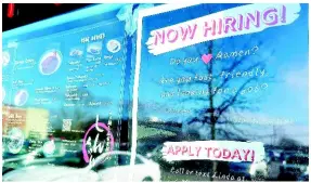  ?? AP ?? A hiring sign is displayed at a restaurant in Glenview, Illinois, on Monday, January 29. Yesterday, the Labor Department reported on the number of people who applied for unemployme­nt benefits last week.