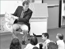  ?? Crystal Duan/The Signal ?? State Sen. Scott Wilk, R-Santa Clarita, reads a story to children during his visit to Dr. J. Michael McGrath Elementary School on Friday.