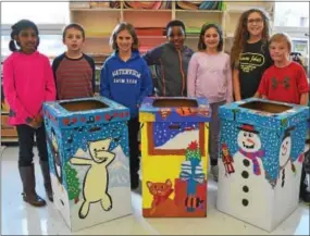  ?? SUBMITTED PHOTO ?? Elementary students in the West Chester Area School District helped draw and paint holiday themes and scenes onto toy donation boxes for the Greater West Chester Chamber of Commerce’s annual holiday toy drive