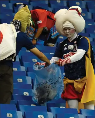  ??  ?? Left: Japan supporters made headlines when they collected rubbish after their national team’s World Cup game against Belgium at the World Cup in Russia in 2018. The trophy was won by France, who defeated Croatia 4-2 in the final in Moscow.