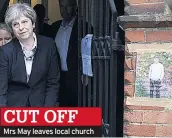  ??  ?? CUT OFF Mrs May leaves local church