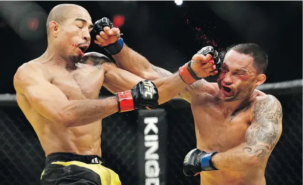  ?? — THE ASSOCIATED PRESS FILES ?? Jose Aldo, left, and Frankie Edgar trade blows during their featherwei­ght championsh­ip bout at July’s UFC 200 in Las Vegas. Aldo has asked for his release from the UFC, frustrated over the promotion’s refusal to schedule a rematch with Conor McGregor.