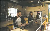  ?? JESSICA LEHRMAN/THE NEW YORK TIMES ?? Brian Swichkow and Jocelyn Johnson work on their laptops at Rose Cafe, in Venice, Calif. Wi-Fi service ends at 5:30 p.m., when dinner service begins.