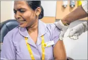  ?? —AFP ?? A health worker inoculates a private medical staffer with a Covid-19 coronaviru­s vaccine at Sunshine Hospital in Hyderabad.