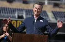  ?? SANDY HUFFAKER – THE ASSOCIATED PRESS ?? California Gov. Gavin Newsom speaks at a news conference at Petco Park, which would host a vaccinatio­n site in a parking lot next to the ballpark, on Feb. 8, 2021, in San Diego.