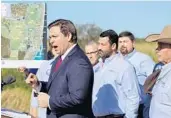  ?? AMY BETH BENNETT/SOUTH FLORIDA SUN SENTINEL ?? Gov. DeSantis on Wednesday announced a massive land buyout that will kill a plan to drill for oil in the Everglades.