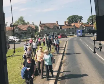  ??  ?? Wearside Field Club walkers returning to the coach at Hovingham ready to go home.