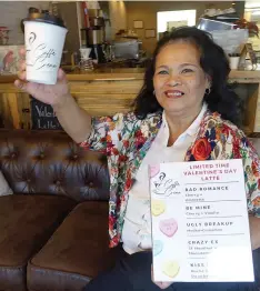  ?? (Photo by Neil Abeles) ?? Starting it all, Elena Johnson holds a cherry and amaretto gift latte Valentine.