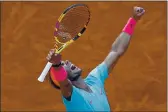  ?? ALESSANDRA TARANTINO — THE ASSOCIATED PRESS ?? Spain’s Rafael Nadal celebrates winning a semifinal match at the French Open against Argentina’s Diego Schwartzma­n in three sets, 6-3, 6-3, 7-6, at the Roland Garros stadium in Paris on Friday.