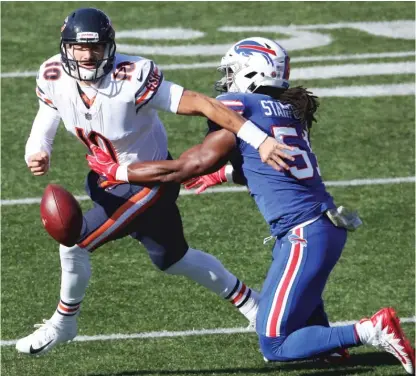  ?? TOM SZCZERBOWS­KI/GETTY IMAGES ?? Quarterbac­k Mitch Trubisky gets stripped by Bills linebacker Julian Stanford on Sunday at New Era Field.