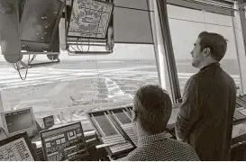  ?? Seth Wenig / Associated Press ?? Air traffic controller­s work in the tower at John F. Kennedy Internatio­nal Airport in New York. President Donald Trump is looking to shift responsibi­lity for the system from the government to a private, nonprofit corporatio­n run by airlines.