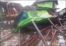  ?? Military True News Informatio­n Team photo via AP ?? Buildings damaged by Cyclone Mocha are seen in Kyauk Phyu township, Rakhine State on Sunday.