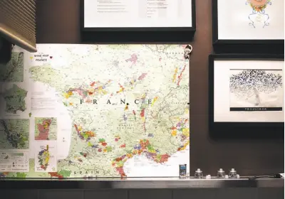 ??  ?? A map of France, Bruno’s homeland, hangs in the kitchen of Baumé, which has earned two Michelin stars. The chef at the tiny Palo Alto restaurant.