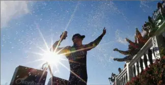  ?? JONATHAN FERREY, GETTY IMAGES ?? Kyle Busch celebrates in Victory Lane after winning the Monster Energy NASCAR Cup Series Overton’s 400 at Pocono Raceway on Sunday. “I never thought this day would happen,” Busch said.