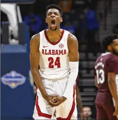  ?? JOHN AMIS/ASSOCIATED PRESS ?? Alabama forward Brandon Miller reacts to scoring Friday against Mississipp­i State in the third round of the SEC Tournament in Nashville, Tennessee. The top-seeded Crimson Tide never trailed in notching a 72-49 victory.