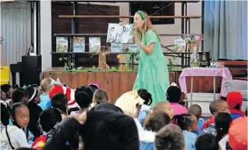  ?? ?? PENZANCE Primary School pupils enjoy a storytelli­ng session delivered by author Roslynne Toerien during their Book Character Day celebratio­n at the school hall. | TUMI PAKKIES Independen­t Newspapers