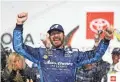  ?? STEVE HELBER/AP ?? Martin Truex Jr. (19) celebrates winning the NASCAR Cup series race at Richmond Raceway on Saturday in Richmond, Va.