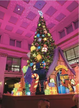  ?? PHIL POTEMPA/POST-TRIBUNE ?? The Great Tree, the annual festive focal point of the Walnut Room restaurant on the seventh floor of Macy’s on State Street in Chicago, is celebratin­g its 115th anniversar­y in 2022 with a toy shop theme and will remain on display until Jan. 8.