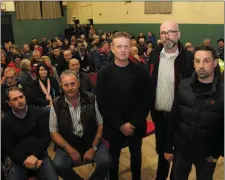 ??  ?? Organisers and some of the crowd at the meeting to highlight concerns over a proposed windfarm in Gneeveguil­la last Monday.