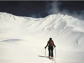  ?? Chris Carr / Special to The Chronicle ?? On cross-country skis, Jenn Carr ventures on the moraines at the foot of Avalanche Gulch at Mount Shasta, the Northern California gem that has become the anti-Tahoe.