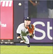  ?? Mike Stobe / Getty Images ?? The Yankees’ Clint Frazier catches a line drive off the bat of the Brewers’ Keon Broxton on July 7 at Yankee Stadium.