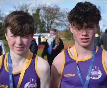  ??  ?? Joe Byrne (S.B.R.) and BenWall (United Striders), fourth and fifth respective­ly in the Under-14 boys’ race.