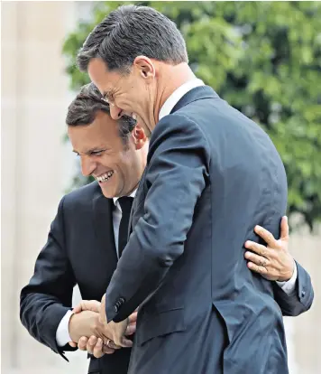  ??  ?? French President Emmanuel Macron welcomed Dutch Prime Minister Mark Rutte to the Elysee Palace in Paris yesterday
