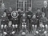  ?? ?? Champions: Harry (circled) and Graham, holding the cup, with the rest of Hunters Hall’s football team in 1949