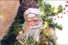  ??  ?? The jolly face of Old Saint Nicholas is shown in this ornament.