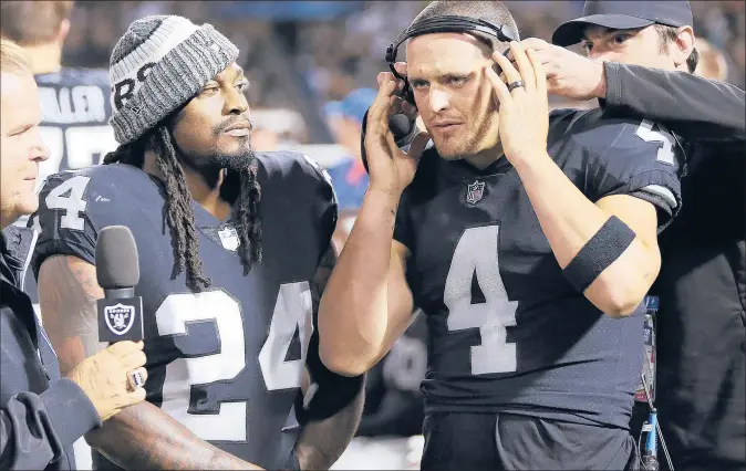  ?? JOHN HEFTI | AP ?? QUARTERBAC­K DEREK CARR, right, and running back Marshawn Lynch are familiar faces in the Raiders’ backfield. The veterans will be playing for a familiar face to Oakland fans as Jon Gruden returns as head coach after spending the past nine seasons in the broadcast booth.