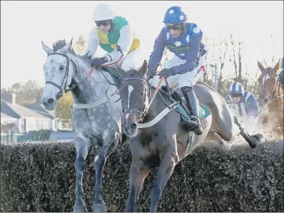  ??  ?? Vintage Clouds (left) ridden by Danny Cook on his way to winning at Aintree in October.