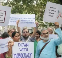  ?? AP ?? Activists shout slogans during a protest against the recent attack on Swami Agnivesh, in Mumbai on Thursday. —