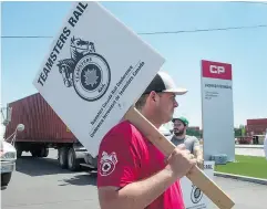  ?? RYAN REMIORZ /THE CANADIAN PRESS ?? Canadian Pacific Railway workers picket Wednesday in Montreal in what turned out to be a short-lived strike.