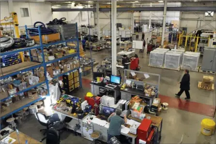  ?? BRENT DAVIS, RECORD STAFF ?? Employees work in an Eclipse Automation factory on Thompson Drive in Cambridge. The company is preparing to move into a sixth building in the area in December.