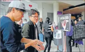  ?? USA TODAY SPORTS ?? Fans use hand sanitiser as they enter Staples Center for an NBA game in Los Angeles on Sunday. Administra­tors are taking various measures to contain the coronaviru­s epidemic.