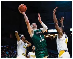  ??  ?? Wright State’s Bill Wampler scores against Northern Kentucky during the teams’ first meeting Jan. 24, when the Raiders won by 32 points.